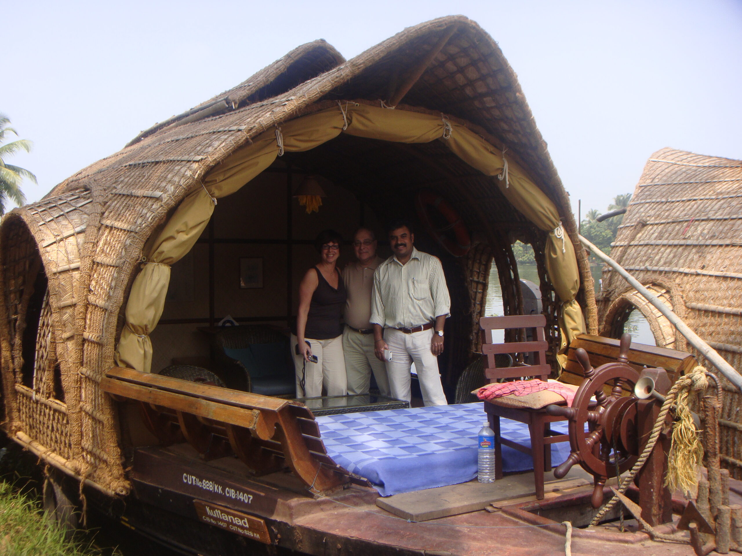 Kerala backwaters with houseboat surrounded by lush green palm trees scenic travel destination India