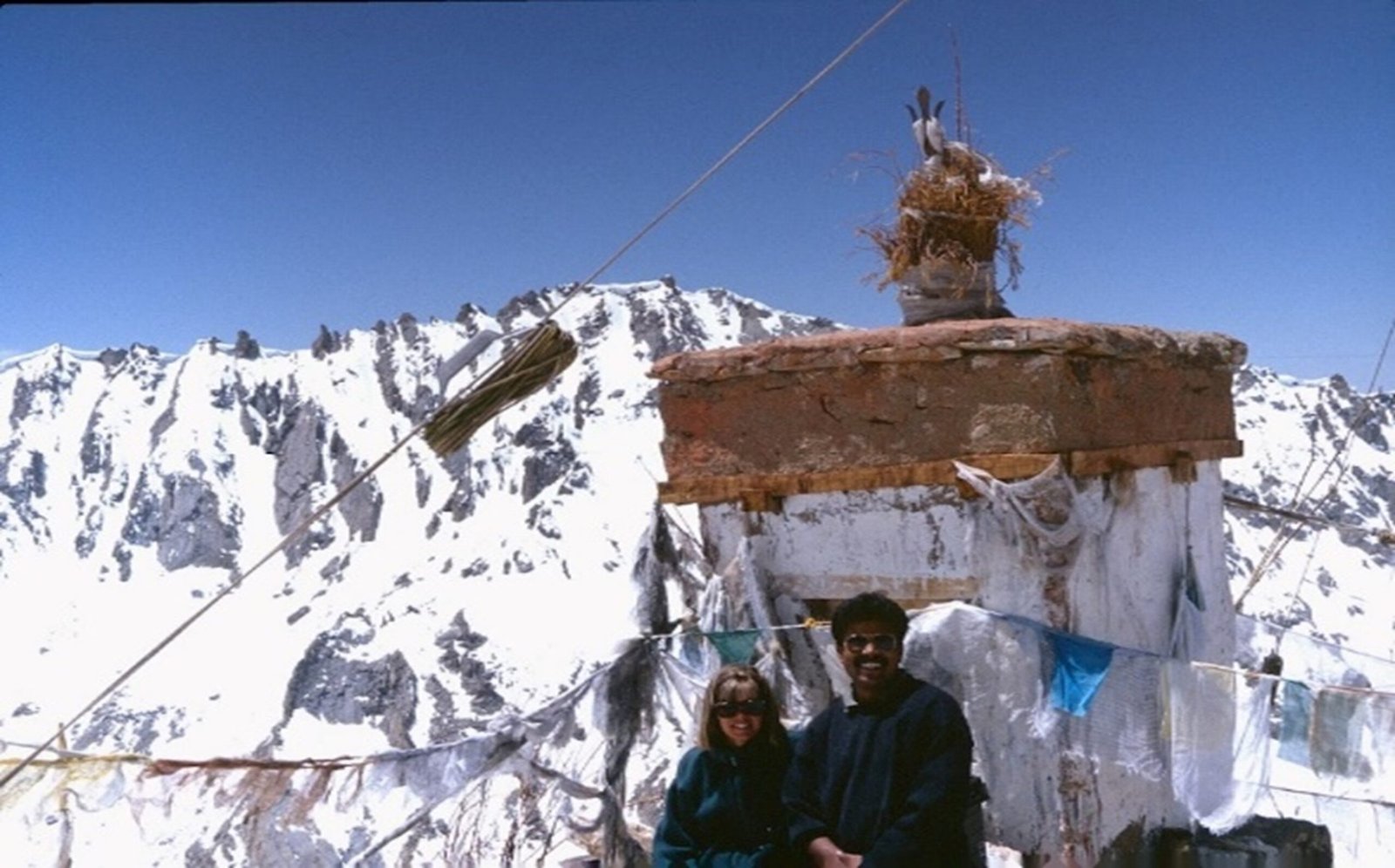 Ramesh Nambiar guiding snow mountain tour in Himalayas with scenic winter landscape