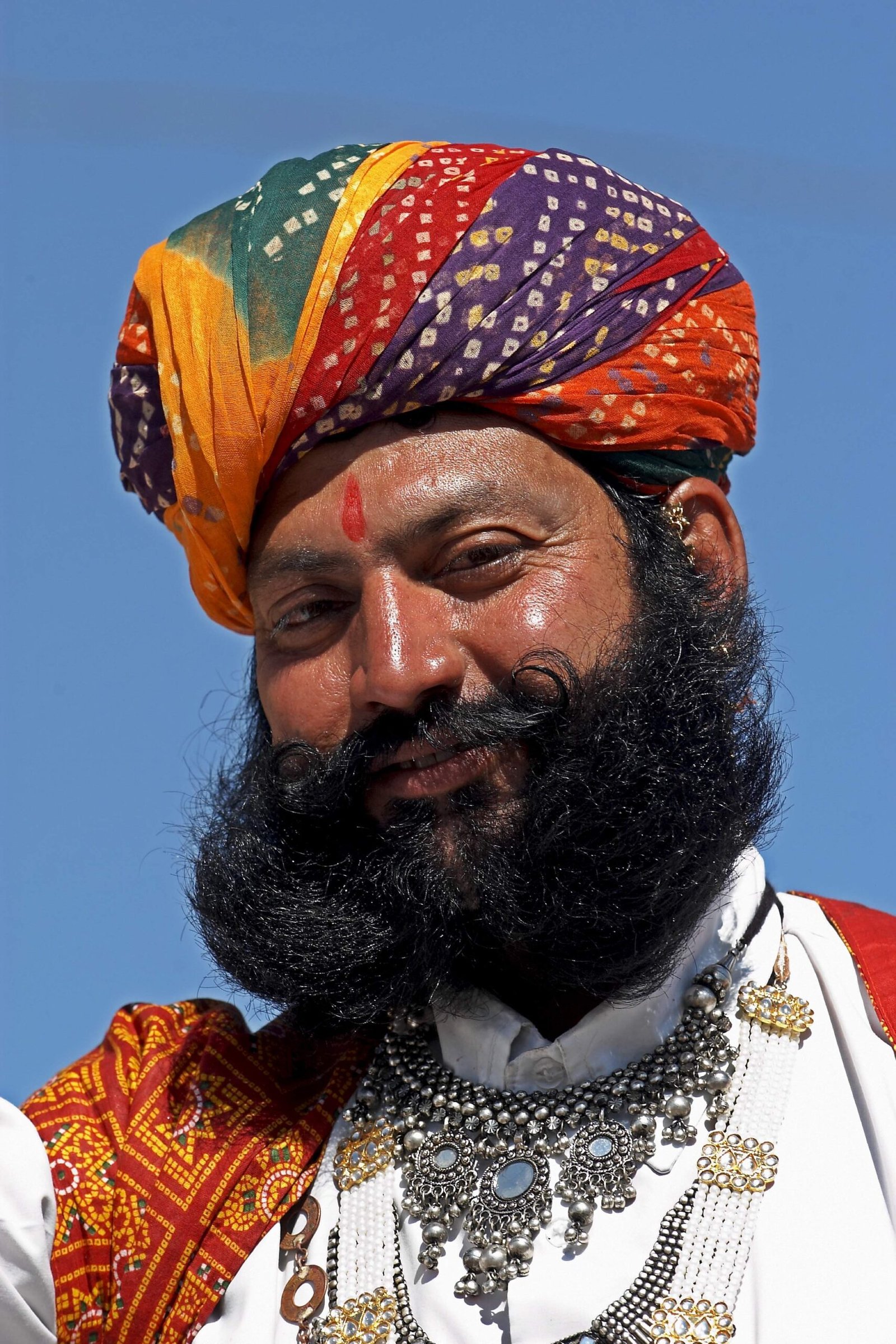 men wearing traditional Rajasthani dress with colorful turbans cultural attire India