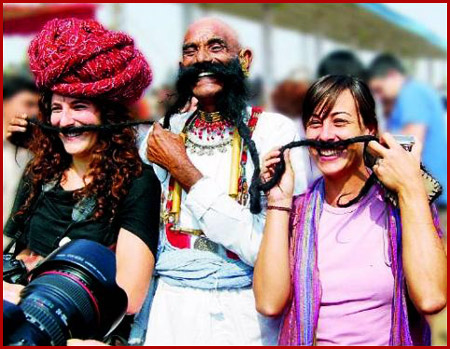 rajasthan folk artist performing cultural act with tourists
