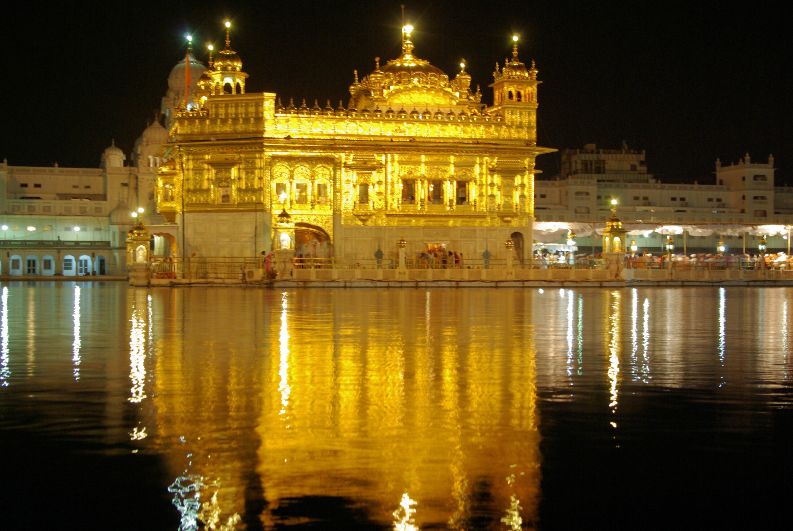 Golden Temple in Amritsar illuminated at night with beautiful reflection in the sacred water
