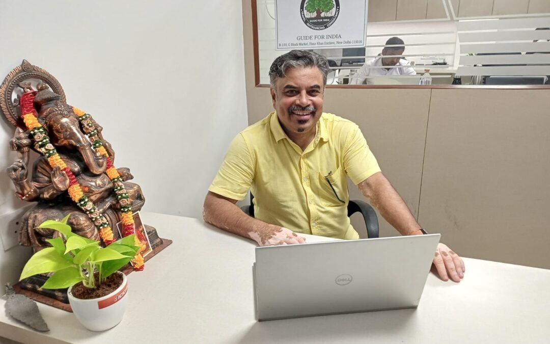 Ramesh Nambiar, private tour guide in India, working at the Guide For India office in New Delhi.